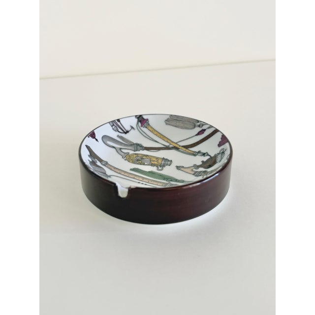 A graphic porcelain ashtray made by producer Elisabeth Liegl in West Germany in the 1960s. It draws on the visual language...