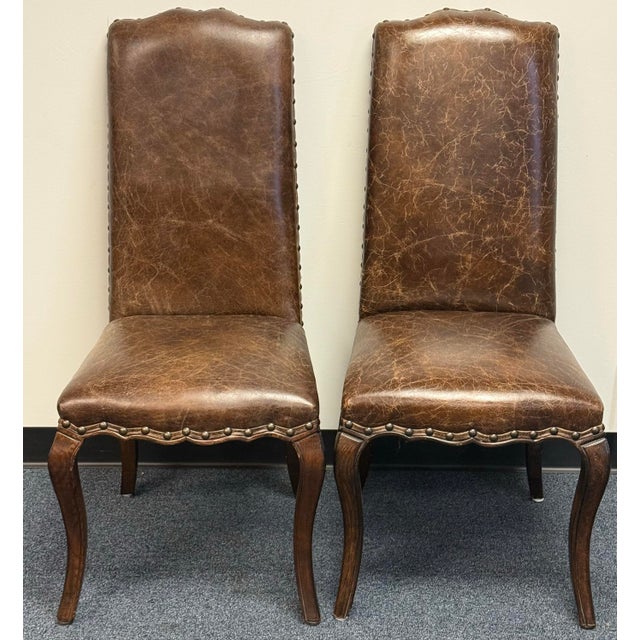 Beautiful set of ten Pottery Barn Calais dining chairs featuring eight in warm tan microfiber upholstery and two in rich...