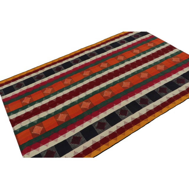 Handwoven in wool, circa 1950-1960, this 5x7 vintage Afghan tribal kilim rug is a quintessential tribal Kilim and a one-...