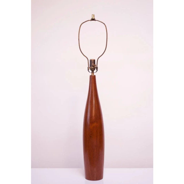 1960s sculptural turned teak Danish lamp by ESA. Features a counterweighted base to better support the tall form. Retains...