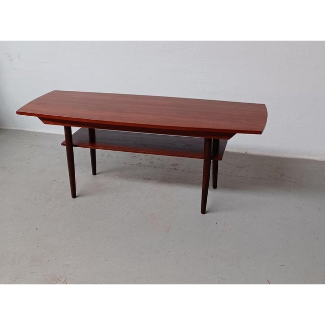 1960s fully restored Danish coffee table in teak. The well dimensioned and designed coffee table with it´s elegant organic...