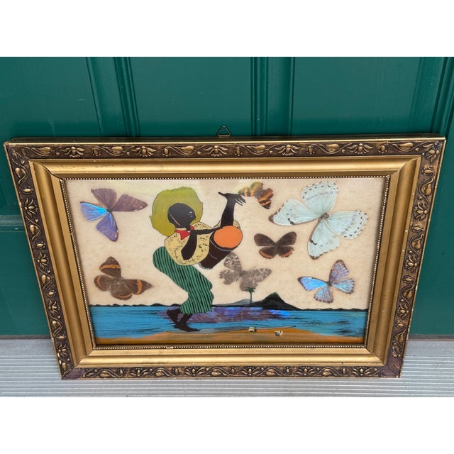 Offering for sale this exceptional vintage butterfly wing artwork, handcrafted using real butterfly wings to create a...