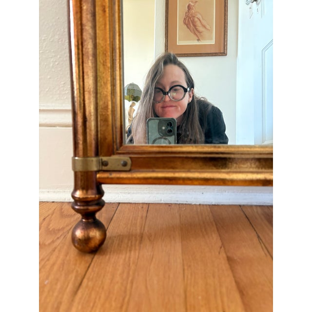 1960s era Hollywood Regency meet campaign style mirror. Mirror is substantial with wood that has been “brassed” and brass...