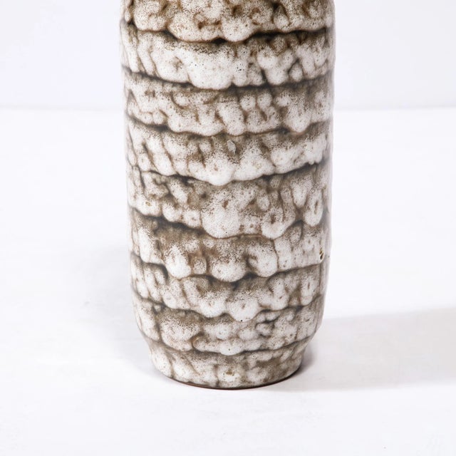 This Mid-Century Modernist Ceramic Vase With Banded Detailing is a beautiful example of Post War European Ceramics,...