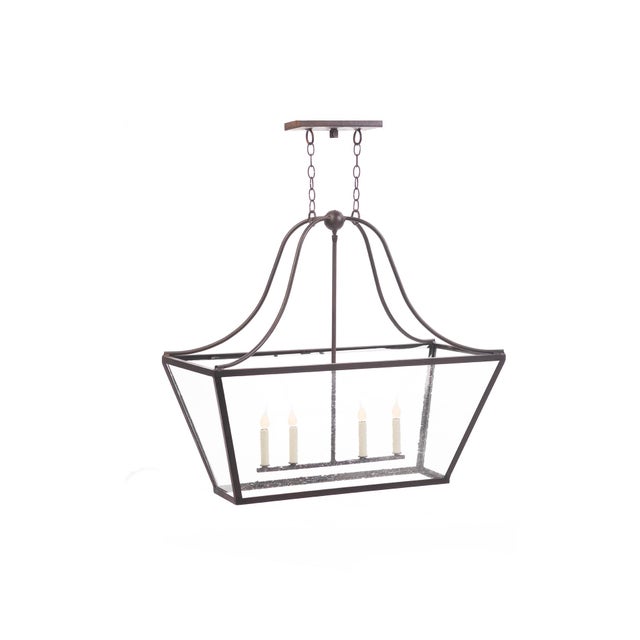The Southern Bell Top Lantern encompasses a curved sturdy steel frame with seeded glass inserts. Four candelabra-style...