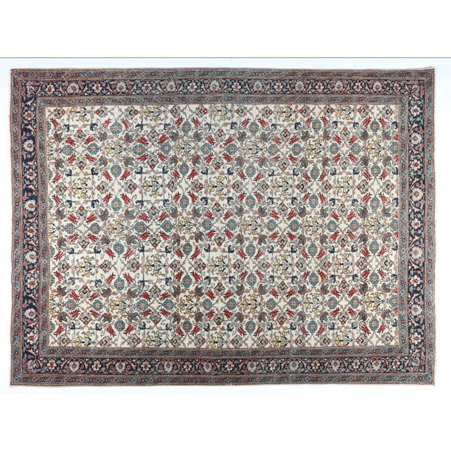 This world-famous Hereke rug is a masterfully hand-knotted piece woven with exceptionally fine wool on a cotton...