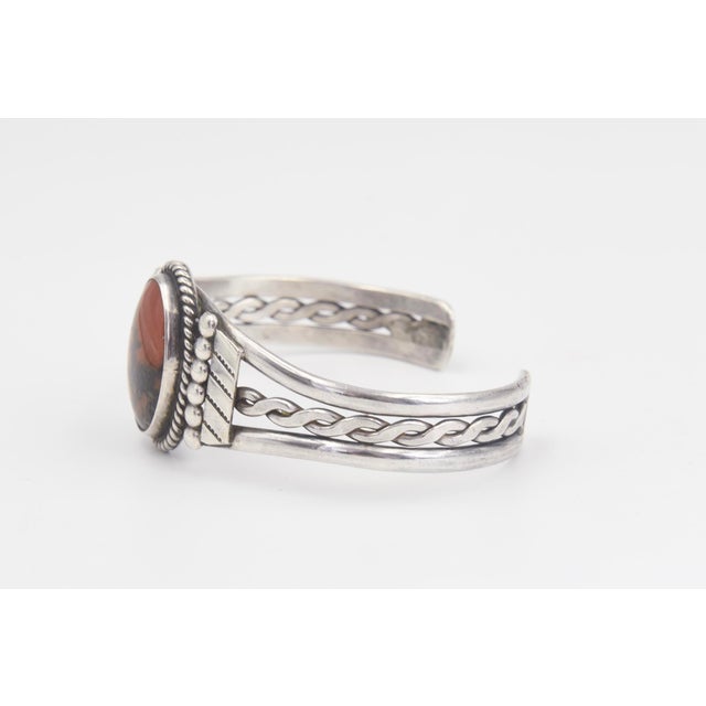 Vintage Southwestern Native American style silver cuff bracelet featuring an oval cabochon jasper. Interior of the cuff...