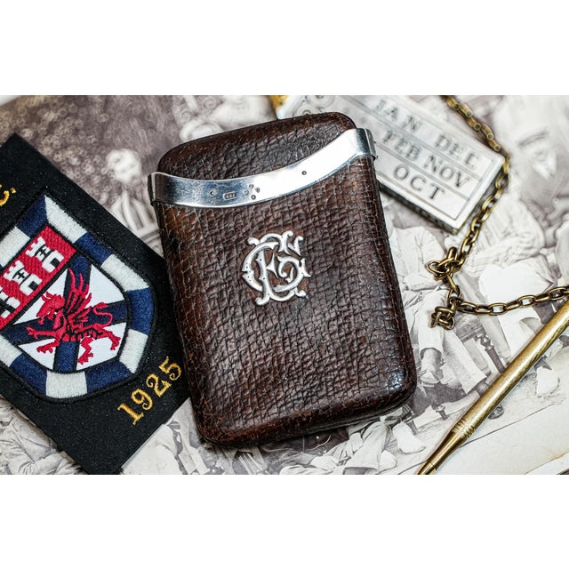 A luxurious Victorian cigar case, crafted in rich, dark textured brown leather and accented with gleaming sterling silver...