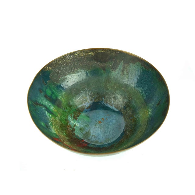This striking Mid-20th Century enamel on copper bowl is a classic example of the post-war studio craft movement, where...