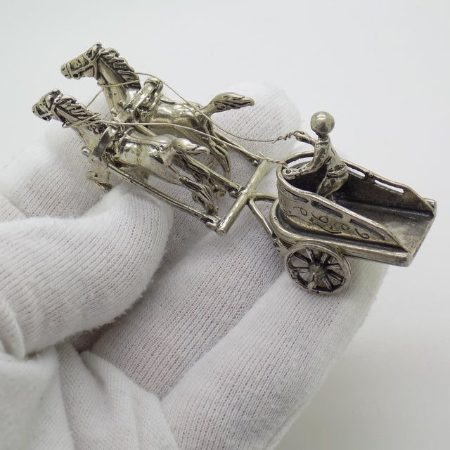A substantial vintage miniature weighing 51 grams, depicting a Roman chariot with horses, handcrafted in Continental...