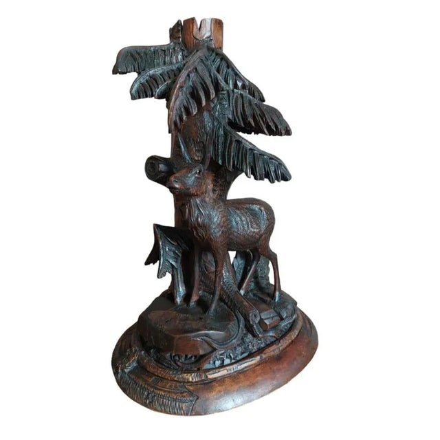 Black forest deer from Brienz Switzerland Witz Glass eye, a lot of floreal design ,thinner carved and lieves Palm Walnut wood