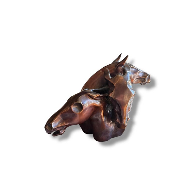 This striking bronze sculpture by Sharon Anderson captures the raw energy, strength, and movement of three horses in a...