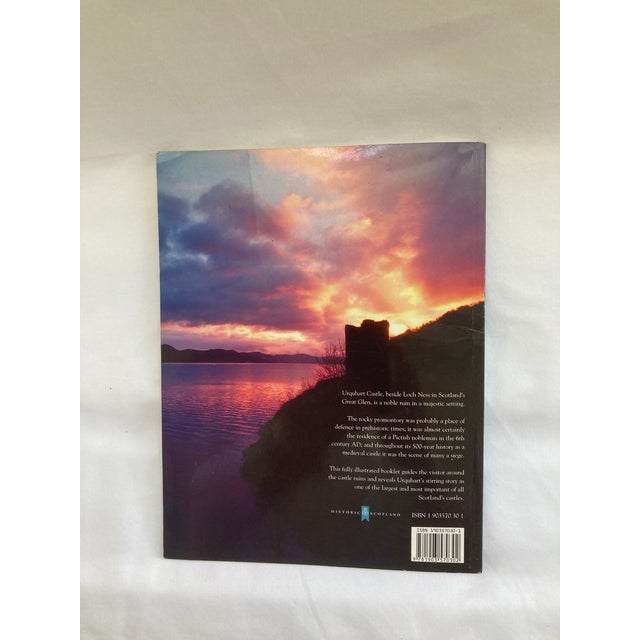 An Historical Booklet published by Historic Scotland in 2002 as the OFFICIAL SOUVENIR GUIDE OF URQUHART CASTLE, a ruined...