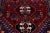 Beautiful Vintage Shiraz hand-knotted Wool rug with a red color field. This piece has a beige frame and multicolor accents...