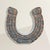 The horseshoe has always promised good luck. This one promises better stories. This vintage American gray painted...