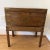 Pretty campaign chest on stand that reveals a sloped writing desk when opened. Keep it closed and enjoy the pretty brass...
