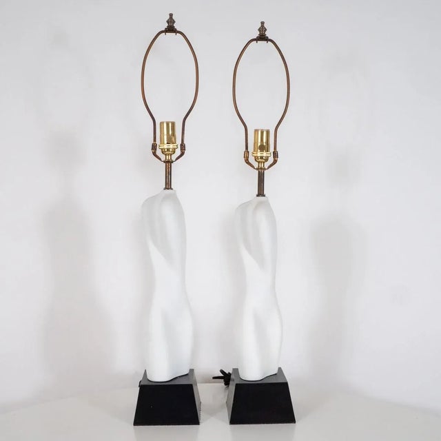 Pair of organic ceramic table lamps on black wood bases. Origin: United States Circa: 1980s Dimensions: 5" wide x 5" deep...
