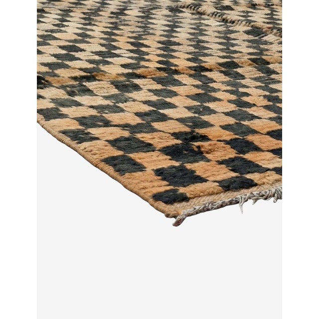 Checkered Moroccan Rug – Handmade Berber Wool Rug This striking handmade Moroccan rug features an allover black and warm...