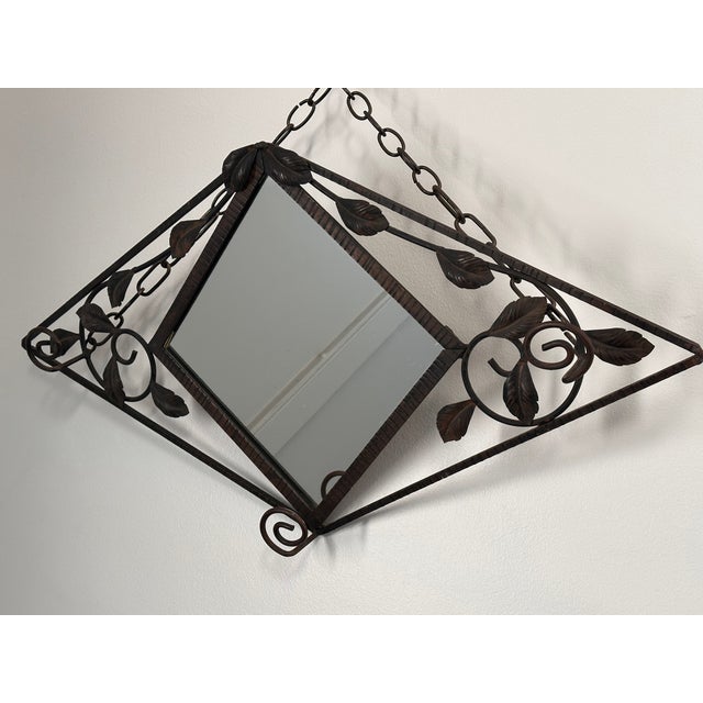 This diamond shaped Art Deco mirror offers a great functionality by having three hat or coat hangers, it is great for a...