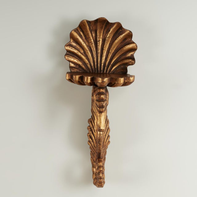 Whimsical grotto style group of four antique Italian wall brackets hand carved from a hardwood with a gilt finish in the...