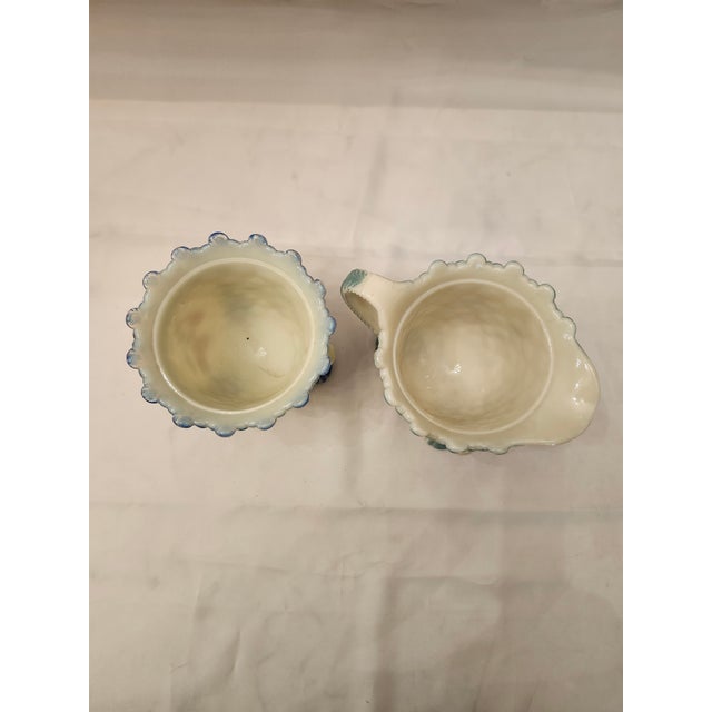 Nice set of Victorian Custard Glass sugar and creamer. This is a nice footed set, that is hand painted with a floral...
