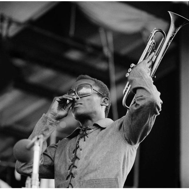 Miles Davis at Newport Jazz Festival American jazz trumpeter, bandleader, and composer Miles Davis (1926 - 1991) plays his...