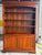 Large two-part library in solid cherry wood with sliding writing surface, French manufacture of fine quality, second half...