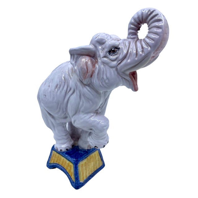 Vintage Italian terracotta elephant performing a trick. The elephant is posed on top of the pedestal. Hand painted and...