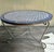 Beautiful Moroccan tiles that are presumably hand made are inset into this 47" diameter tabletop. It rests on a one-piece...