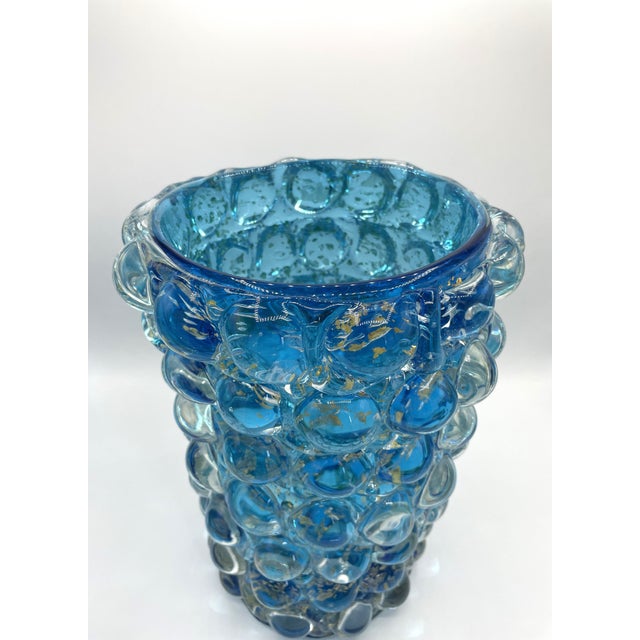A vase from the Lenti series in light blue by Barovier & Toso, dating back to the 1980s, featuring an all-over gold leaf...