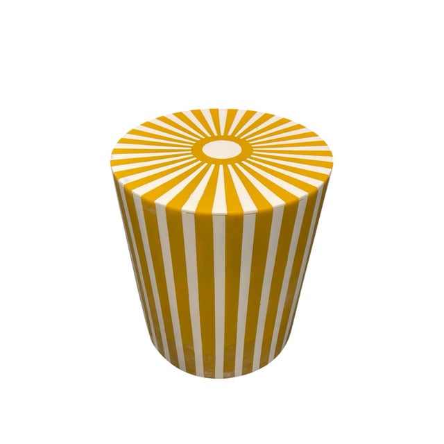 Handcrafted recently in Morocco, this cylindrical side table features a vibrant, geometric aesthetic. The piece is...