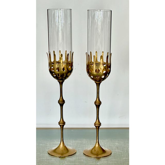 Pair of vintage hurricane solid brass candlestick holders designed by renowned Danish designer Bijorn Wiinblad. Brass in...