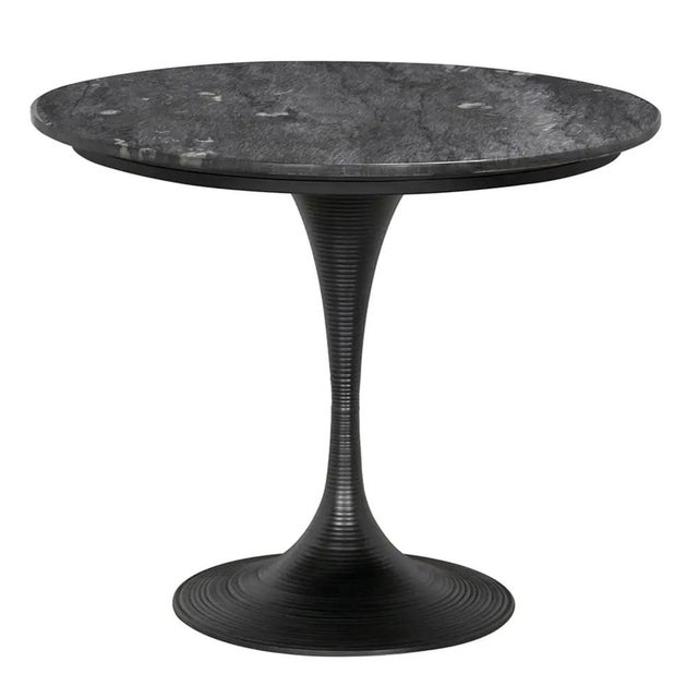 The Joni Table 36" with a Black Finish is a testament to refined design, seamlessly blending industrial aesthetics with...