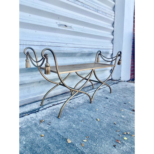 Hollywood Regency Italian rope gilt teasel bench ,features a gilded iron frame with a twisted rope and tassel motif, and a...