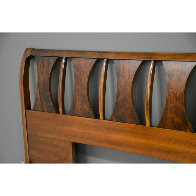 A mid century modern king size walnut and rosewood headboard with curved details made by Kent Coffey Perspecta....
