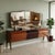 Buffet with mirror and drop-down doors. Made of exotic wood veneer with a polyester finish, a grained front, a back-...