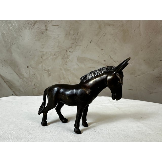 A charming little bronze sculpture from the 1950s depicting a donkey, rendered with great simplicity and expressiveness....