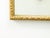 A French giltwood rectangular mirror from the mid-20th century, with carved ovoid motifs. Created in France during the...