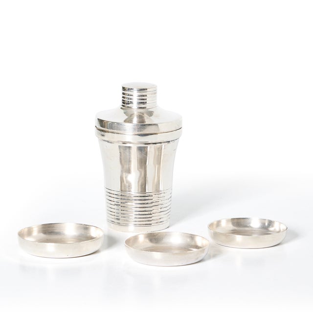 This vintage mini silver plated cocktail shaker is a grand addition to your bar.
