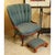 This vintage upholstered piece features a distinctive channel-back silhouette with a scalloped profile and carved wood...