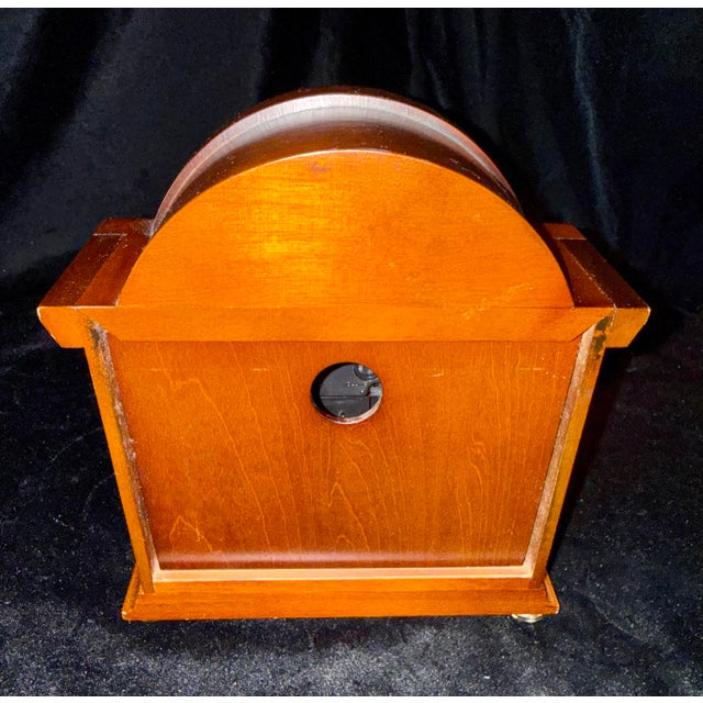 The Seiko Sayo is a traditional quartz mantle clock housed in a stylish wooden case with elegant brass-toned accents. It...