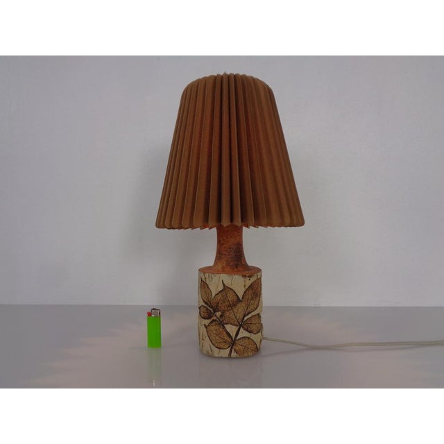 Table lamp with the original pleated lampshade by Bodil Marie Nielsen from the 1960s in very good condition. This piece...