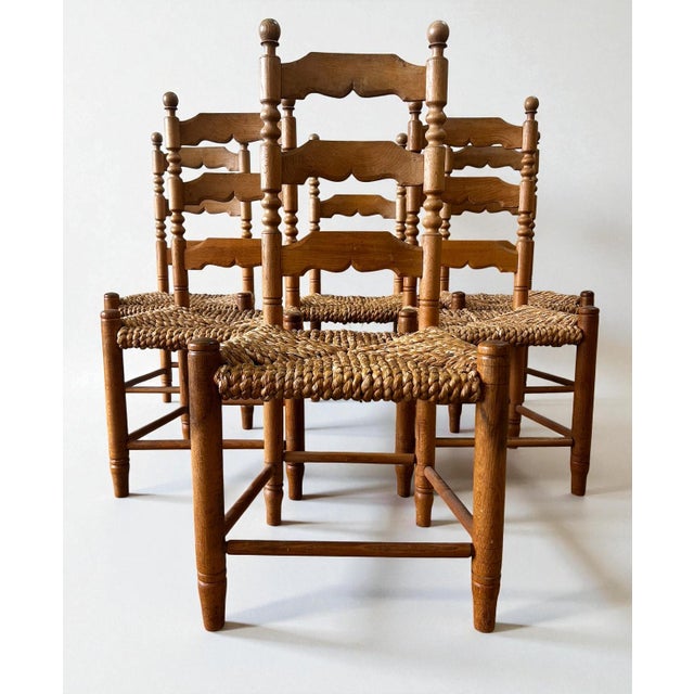 A charming set of six Danish handcrafted chairs attributed to Hans Dau, made in solid oak with traditional hand-braided...