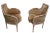 Voguish pair of suede upholstered bergere style chairs, having carved and painted wood frames . Both chairs are in very...