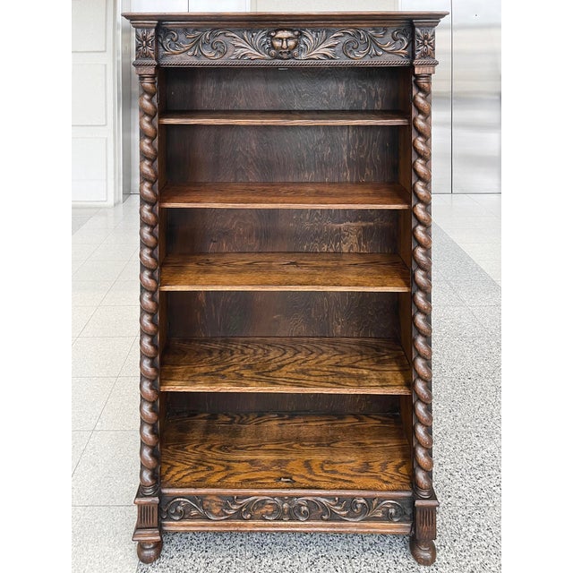 Hand-crafted from oak in the 19th Century in the style of the renowned R.J. Horner & Co., this bookcase cabinet features...