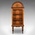 This is a tall antique display cabinet. An English, rosewood and inlaid brass glazed bookcase on stand, dating to the...