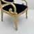 This is a pair of mid-century French neo-classical style carved beech bergere chairs in a navy velvet. The frames have...