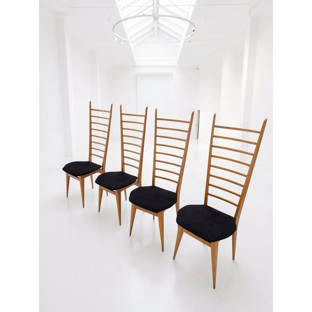 Set of 4 light ash wood chairs with contoured seats upholstered in black chenille velvet. The "chiavarine" model takes its...