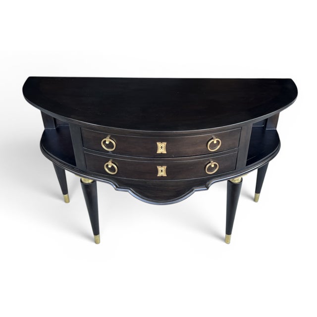 Elegant and timeless, this demi-lune server beautifully blends Hollywood Regency glamour with French Neoclassical...