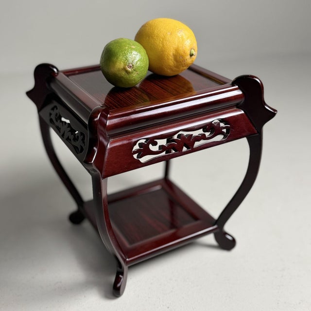 Elegant Japanese plant stand or display stand with a refined, openwork form and a deep reddish-brown sheen. Dimensions:...